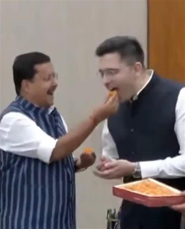 Raghav Chadha Joins BJP; Nitin Nabin Welcomes with Sweets