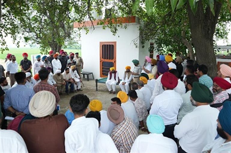 IN A FIRST PEOPLE’S CM INTERACT WITH PEOPLE UNDER SHADES OF TREE