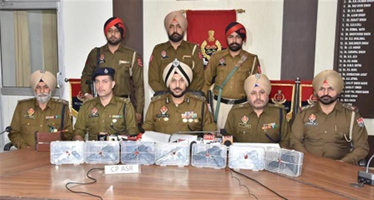 Two linked to cross border smuggling module held with seven sophisticated pistols